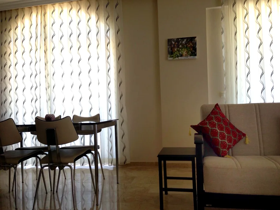 Dining and seating area inside the Calis Sunstay apartment